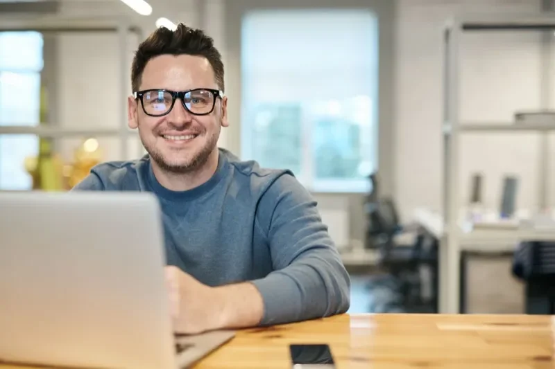 Friendly local tech support professional with laptop