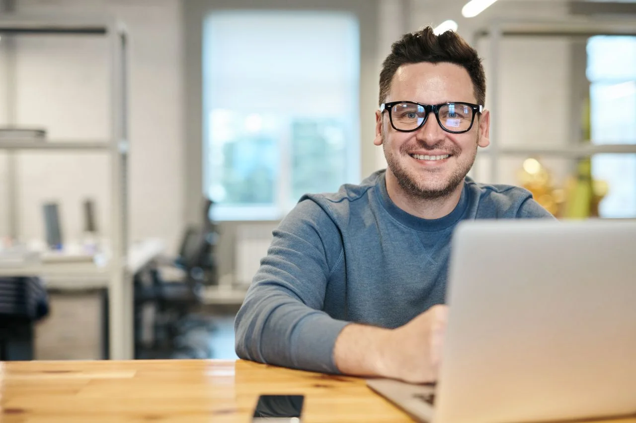 Friendly local tech support professional with laptop