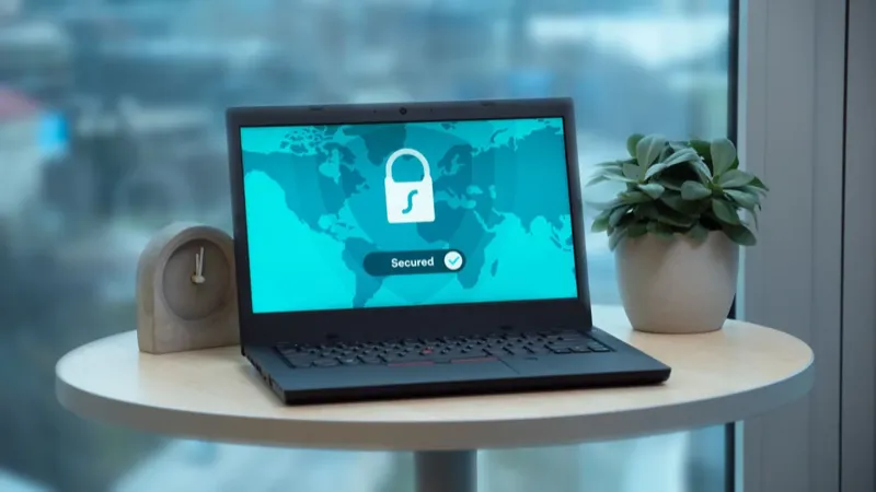 Laptop showing Secured on screen at a clean home desk